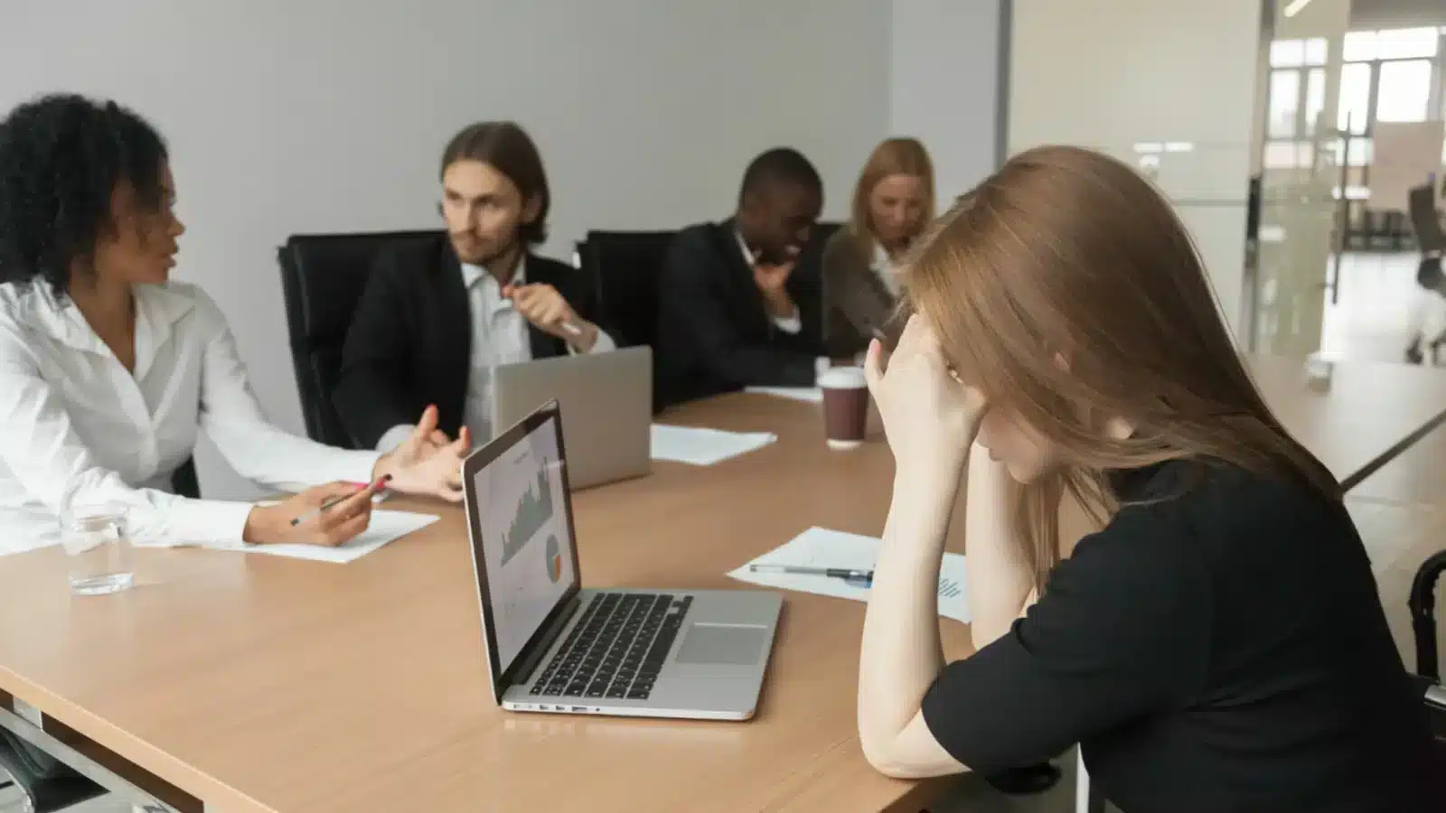 Confident professional standing up against workplace injustice, discrimination, and hostile work environments